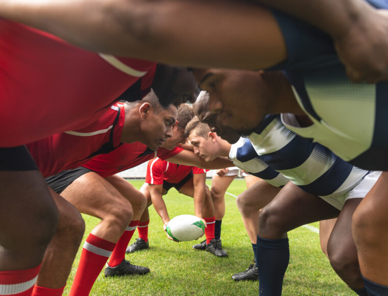 Male Rugby players holding each other to prepare for the Guinness Six Nations match.
