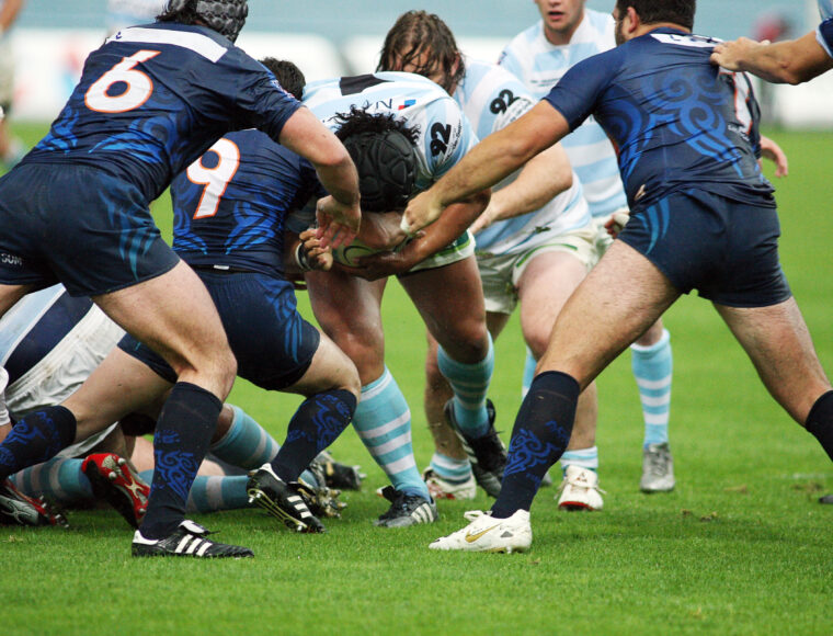 Rugby players tackling each other during the Guinness Six Nations.